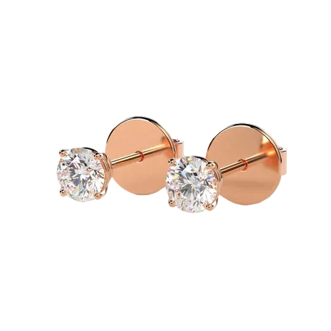 A pair of rose gold stud earrings with round brilliant-cut clear gemstones in a four-prong setting, shown on a light beige background.