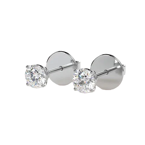 A pair of round-cut diamond stud earrings in a silver setting with flat circular backings, displayed on a light beige background.
