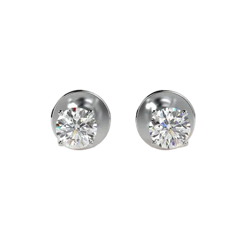 A pair of round-cut diamond stud earrings in a polished silver-tone setting, displayed on a clean, light beige background.