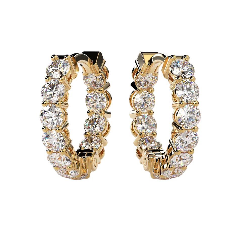 A pair of gold hoop earrings set with round brilliant-cut clear gemstones, displayed on a light beige background.