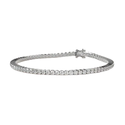 A silver tennis bracelet with a continuous row of round-cut clear stones, displayed on a solid light beige background.