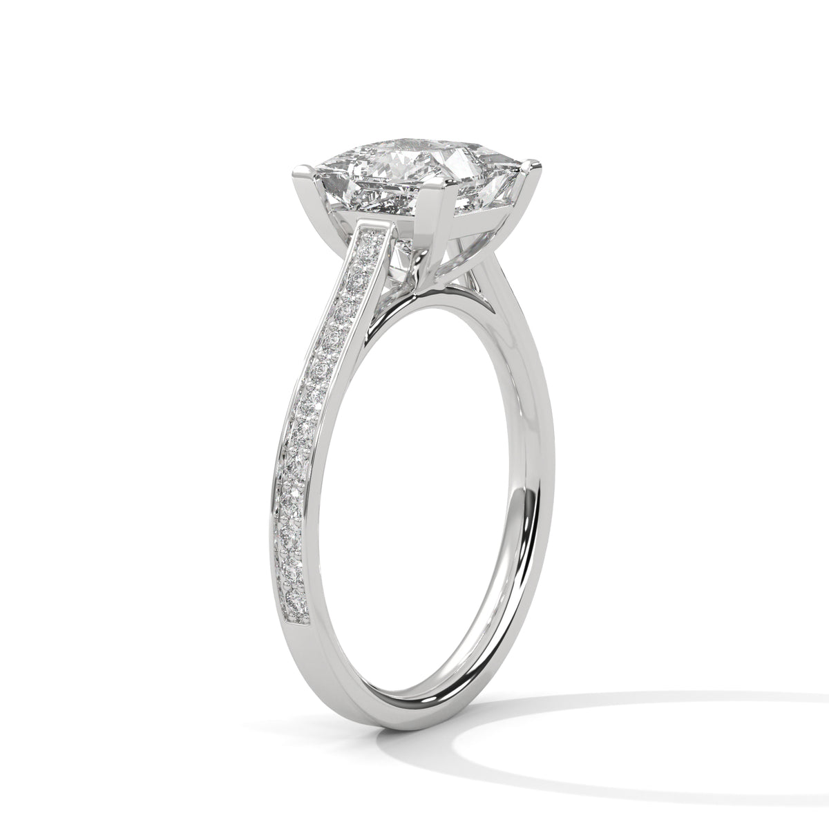 Diamond ring with a large central gemstone and smaller stones on the band against a white background