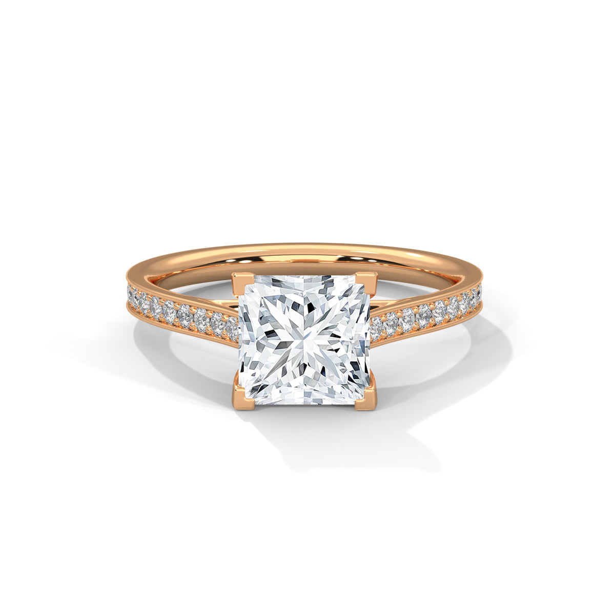 Rose gold ring with a large diamond and smaller diamonds on the band against a white background