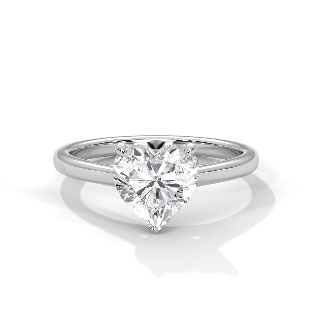 Heart-shaped diamond ring on a white background
