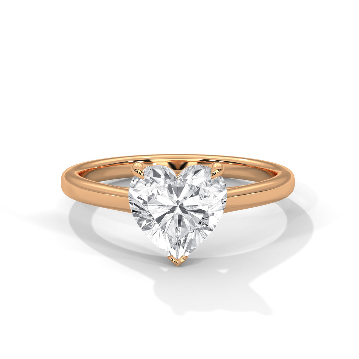 Rose gold ring with a heart-shaped diamond on a white background