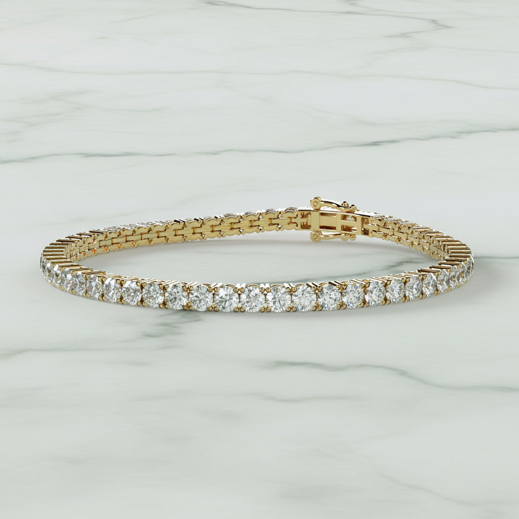 Gold bracelet with diamonds on a beige background