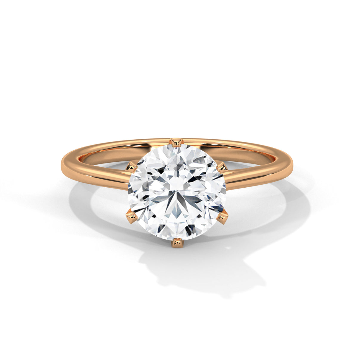 Rose gold ring with a large diamond on a white background