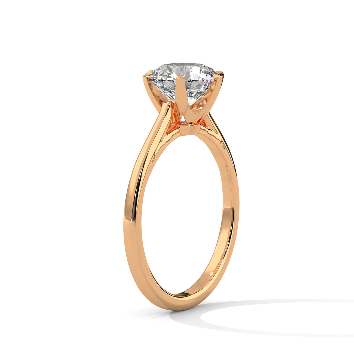 Rose gold ring with a diamond on a white background