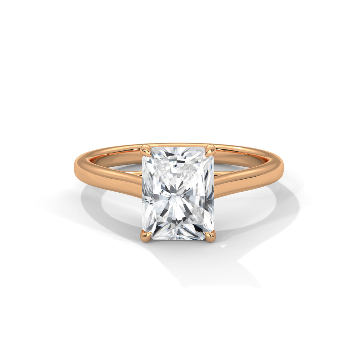 Rose gold ring with a clear gemstone on a white background