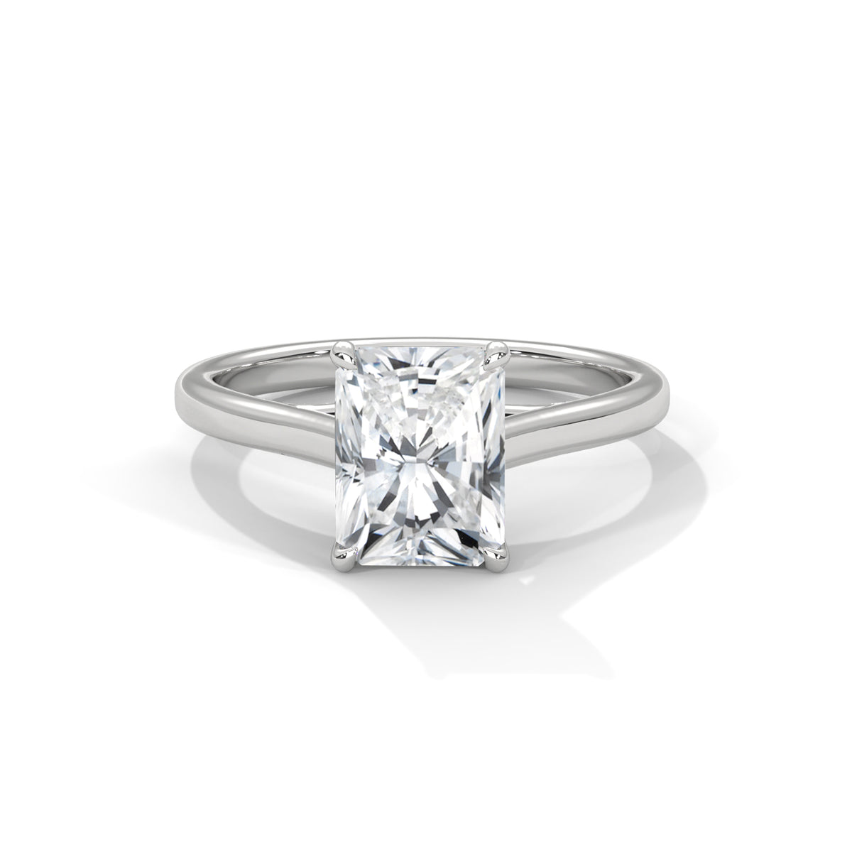 Diamond ring with a princess cut diamond on a white background