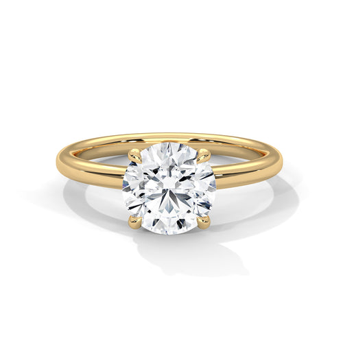 Gold ring with a diamond on a white background