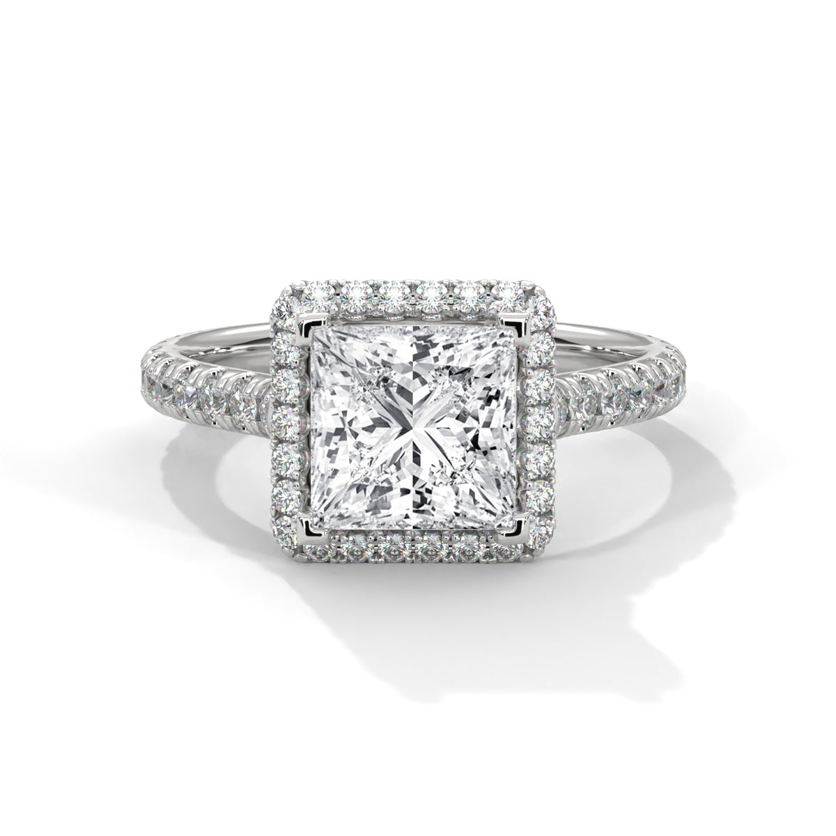 Diamond ring with a square-cut center stone on a white background