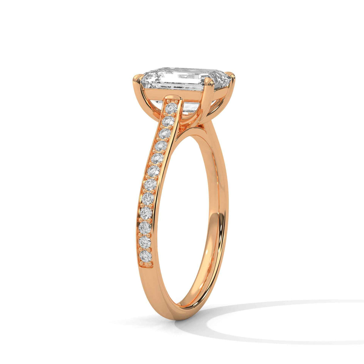 Rose gold ring with a diamond on a white background