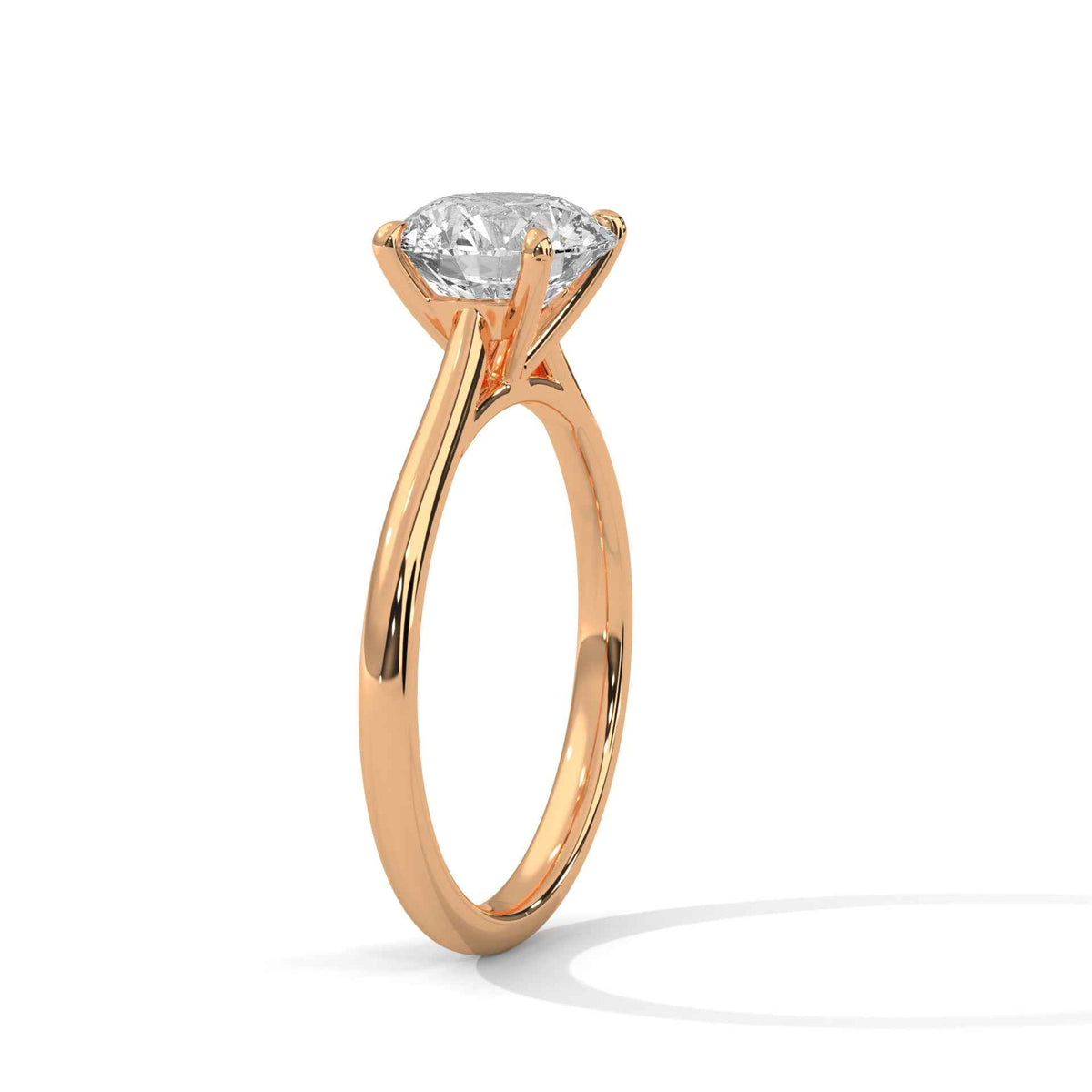 Rose gold ring with a diamond on a white background