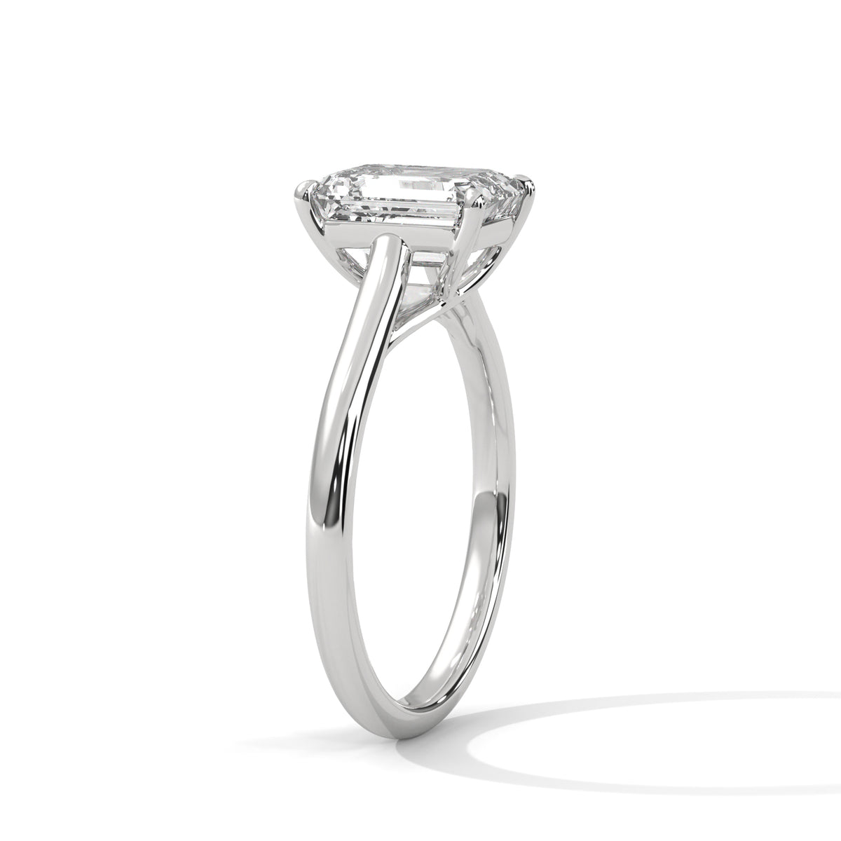 Diamond ring with a rectangular stone on a white background