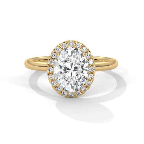 Rose gold ring with a large diamond and smaller diamonds on the band against a white background