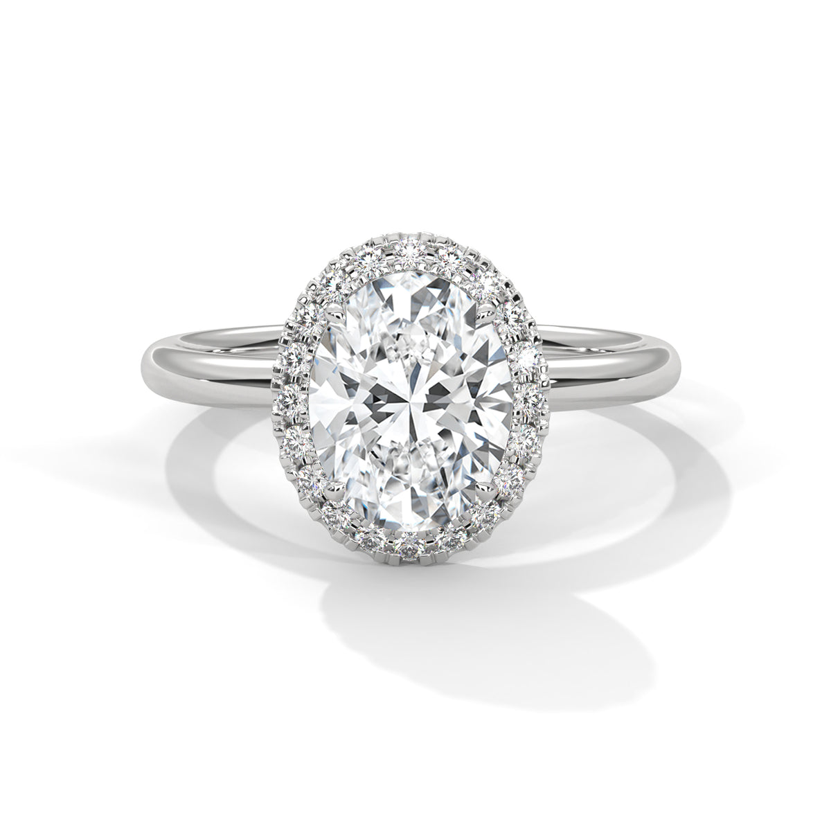 Diamond ring with a halo on a white background