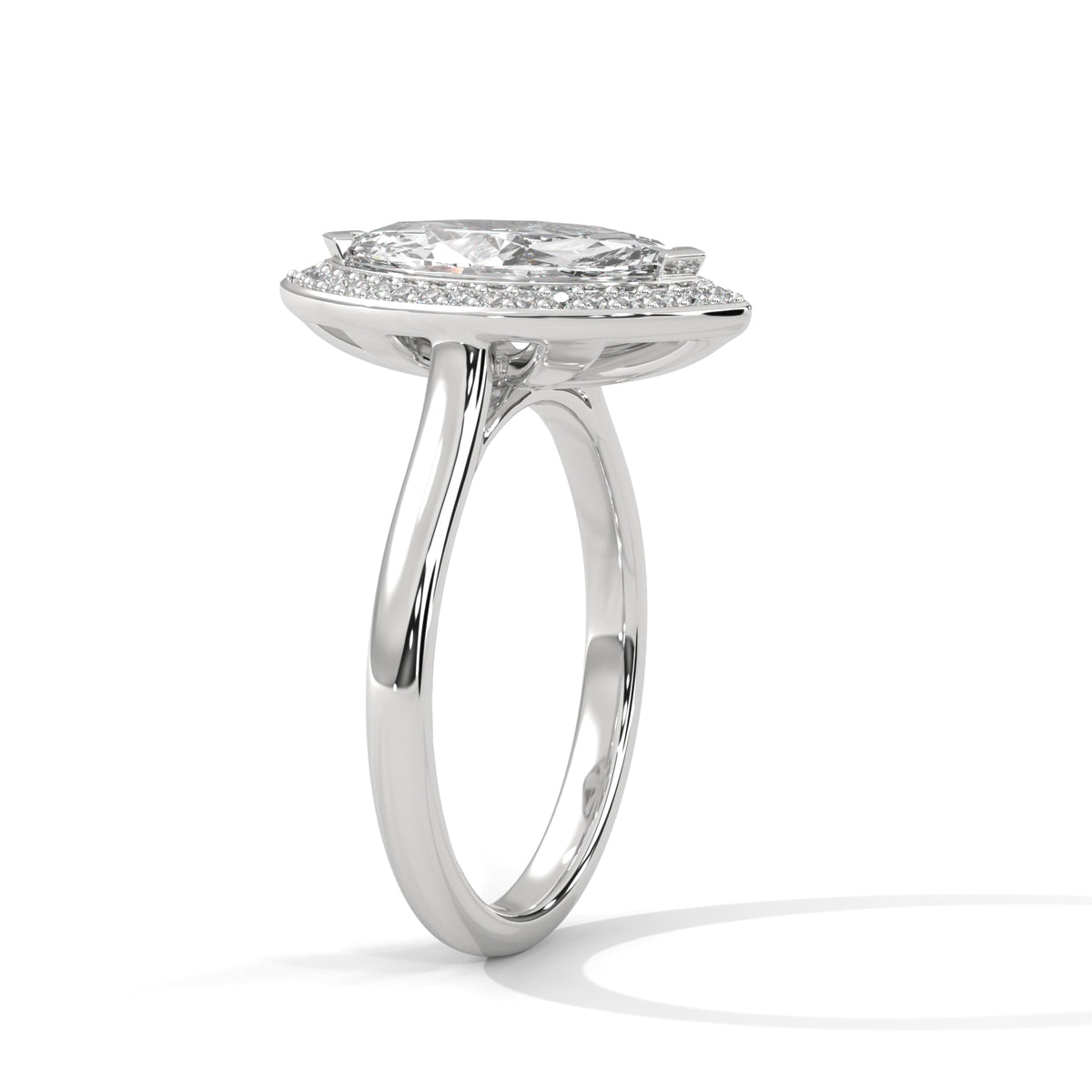 Silver ring with a heart-shaped diamond on a white background