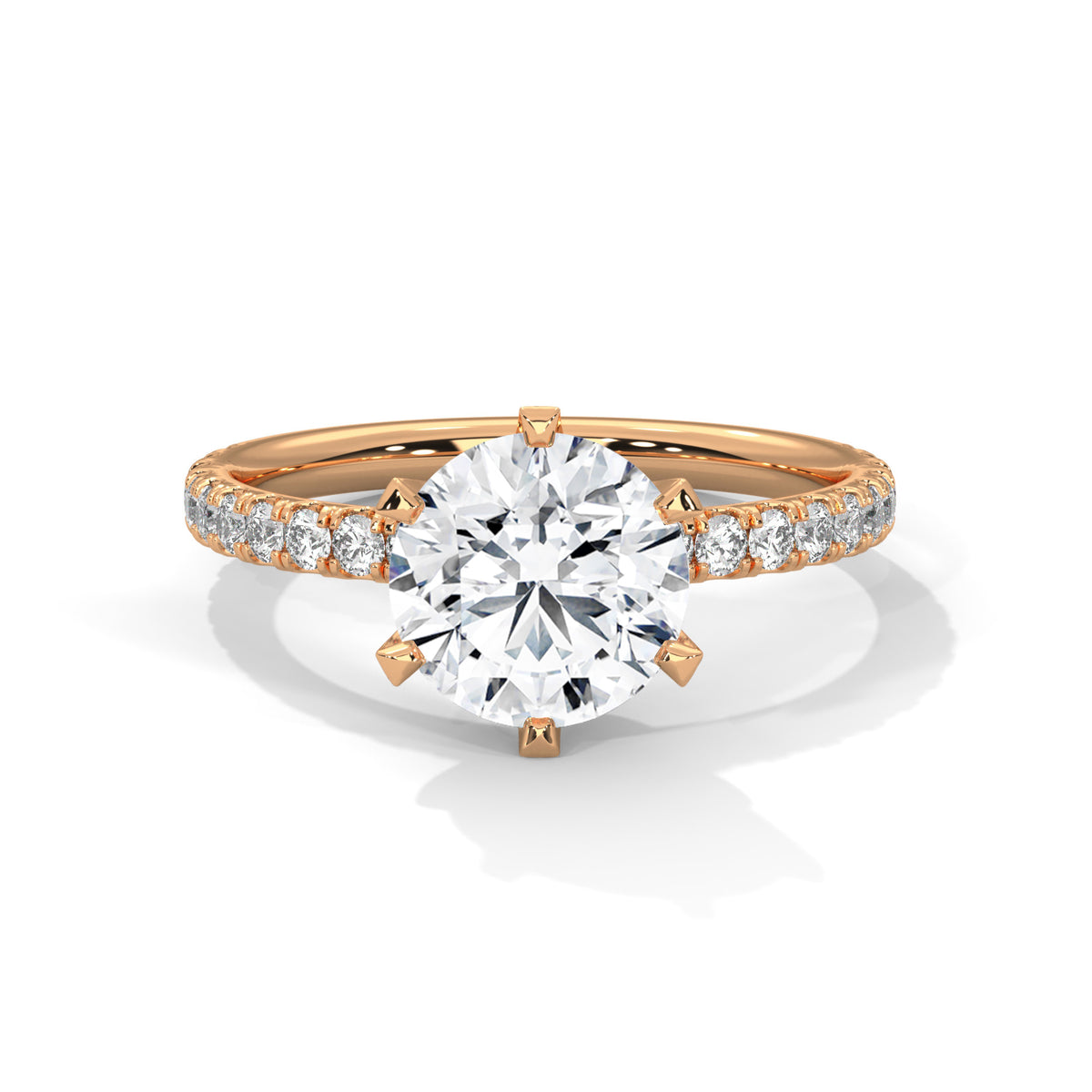 Rose gold ring with a large diamond and smaller diamonds on the band against a white background