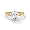 Gold ring with a large diamond on a white background