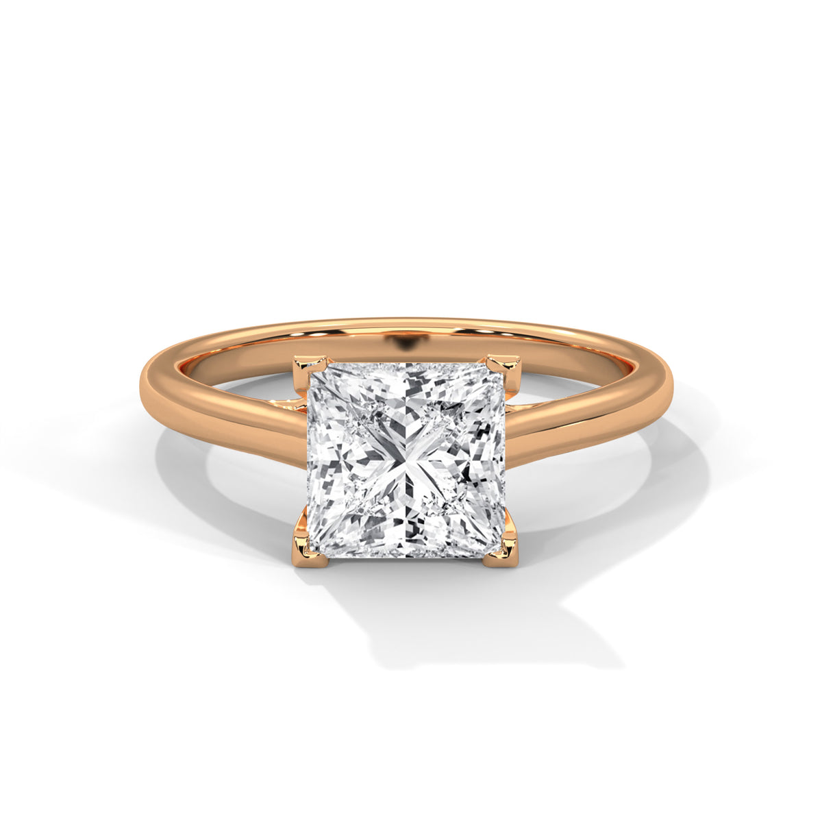 Rose gold ring with a large diamond on a white background