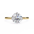 Gold ring with a large diamond on a white background