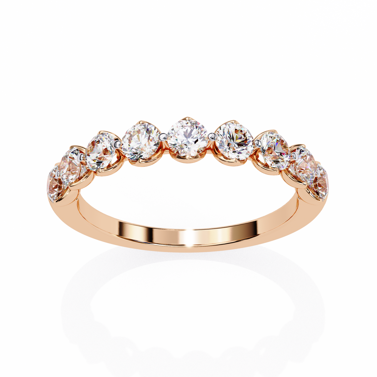 Rose gold ring with clear gemstones on a white background