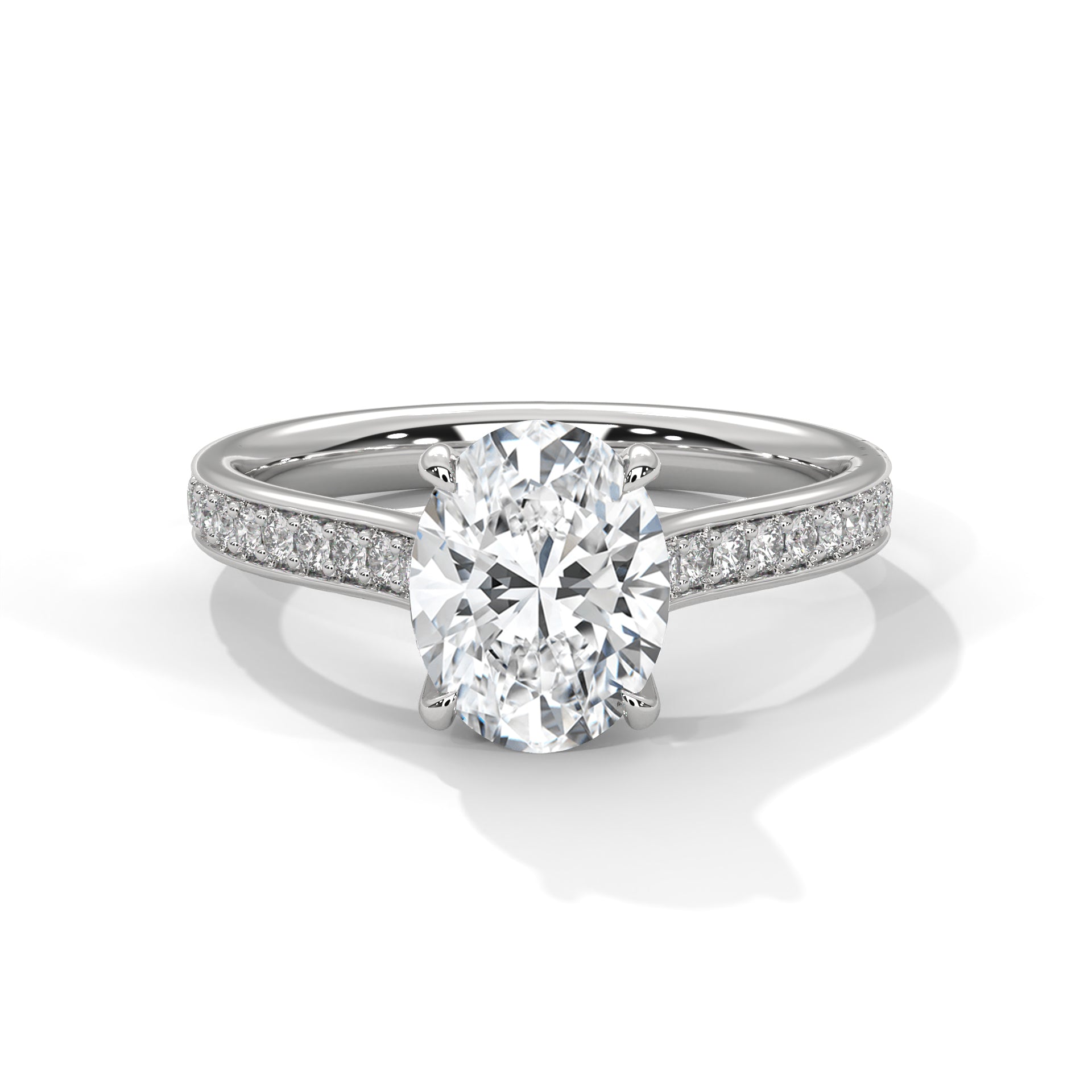 A silver-tone solitaire engagement ring featuring a round-cut diamond in a four-prong setting, with a pavé diamond band, shown on a clean white background.