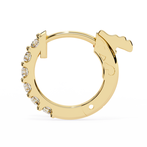 Gold hoop earring with embedded stones on a white background