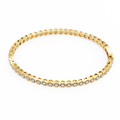 Gold bracelet with embedded diamonds on a white background