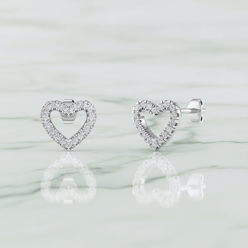 Heart-shaped earrings with small diamonds on a white background