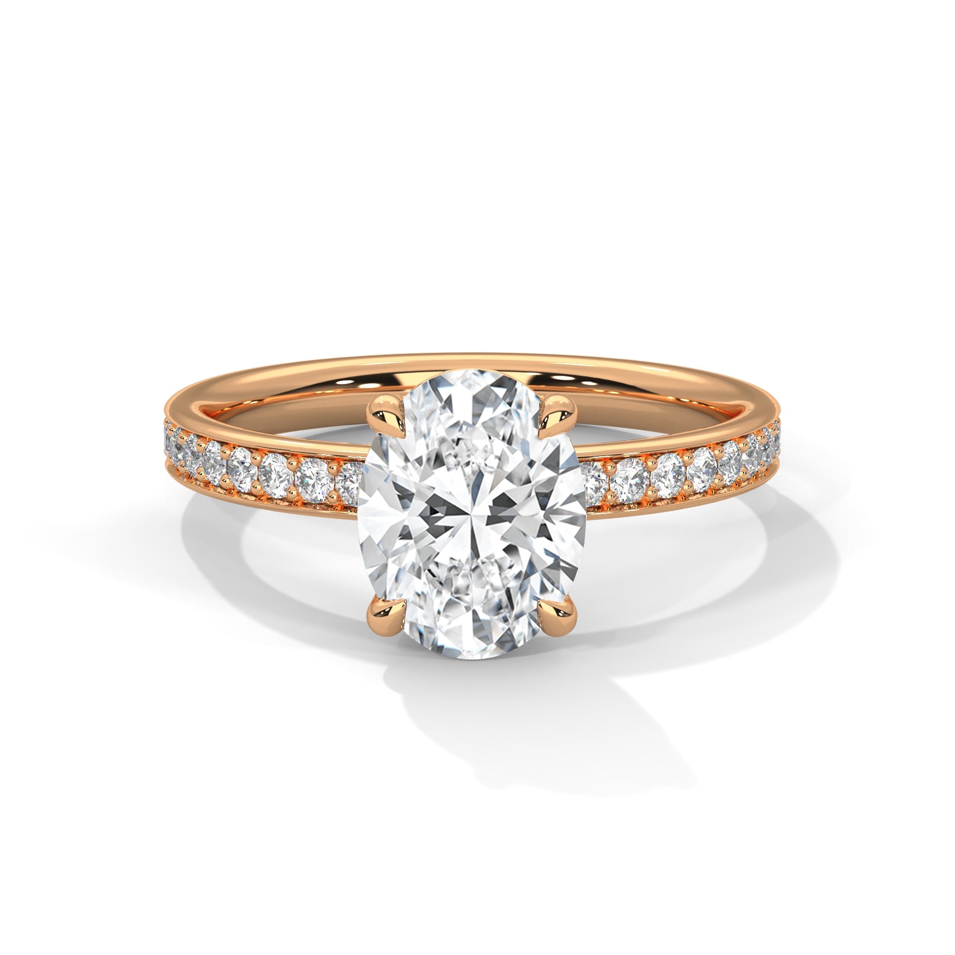 Gold ring with a large diamond and smaller diamonds on the band against a white background