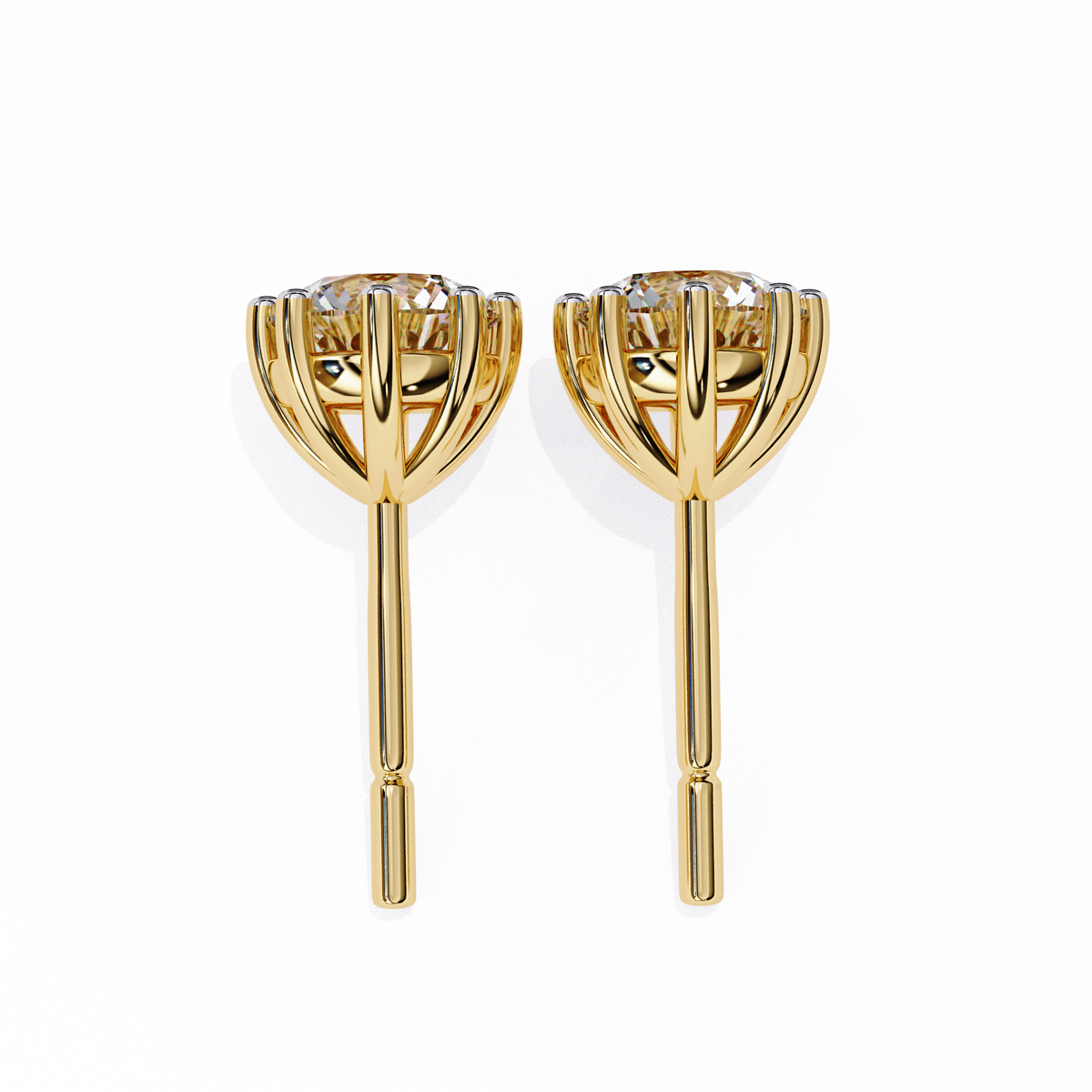 Gold earrings with a central gemstone on a white background