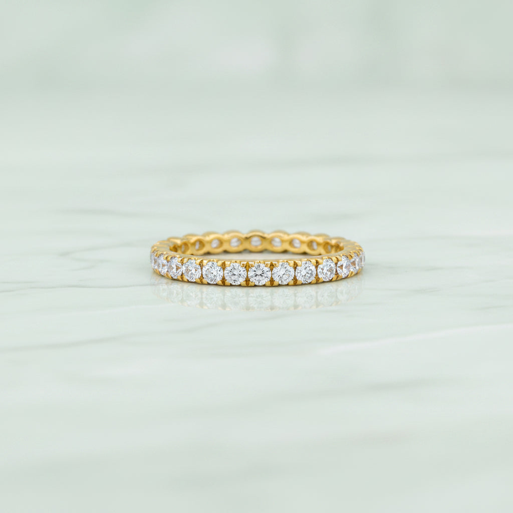 Gold ring with diamonds on a white background
