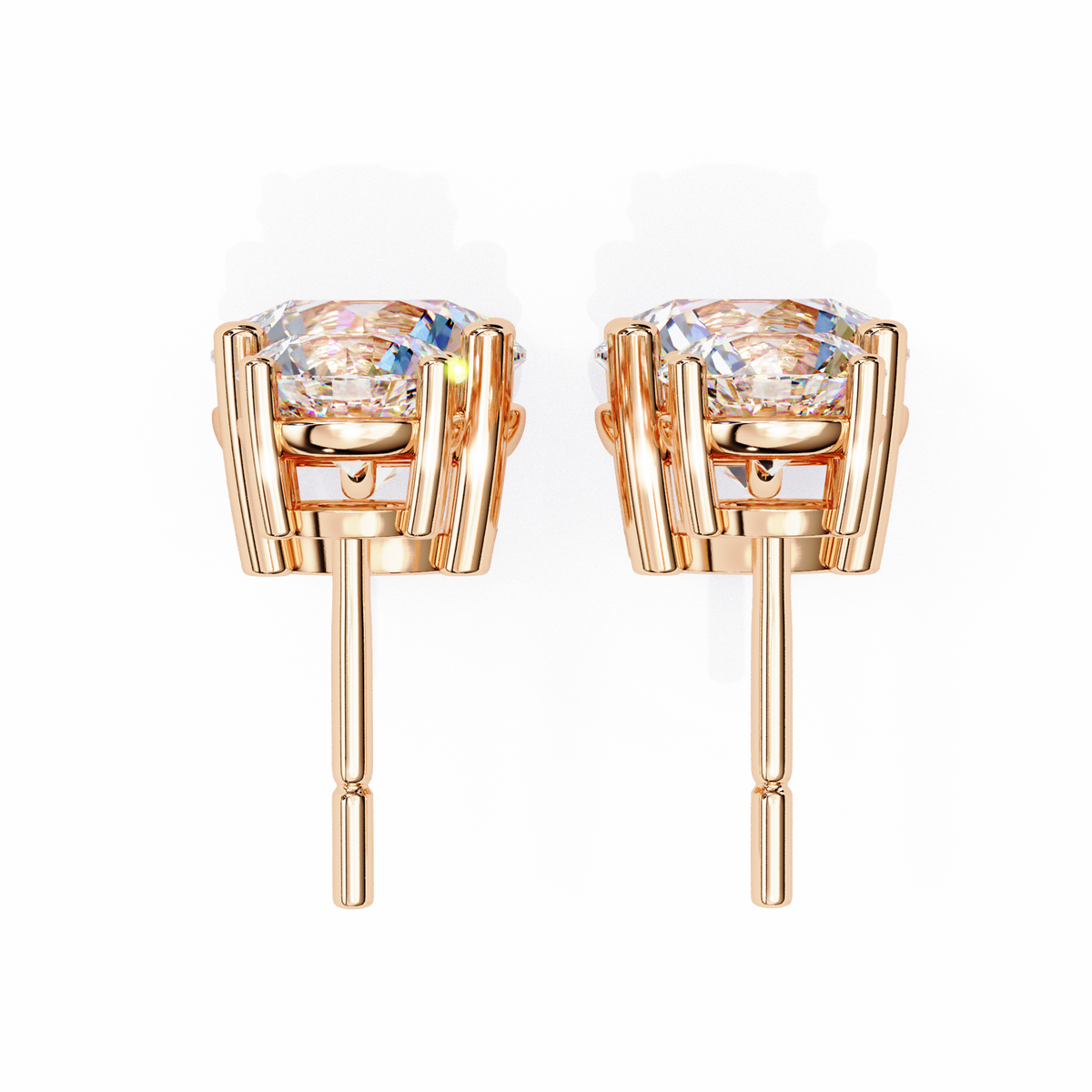 Rose gold earrings with clear gemstones on a white background
