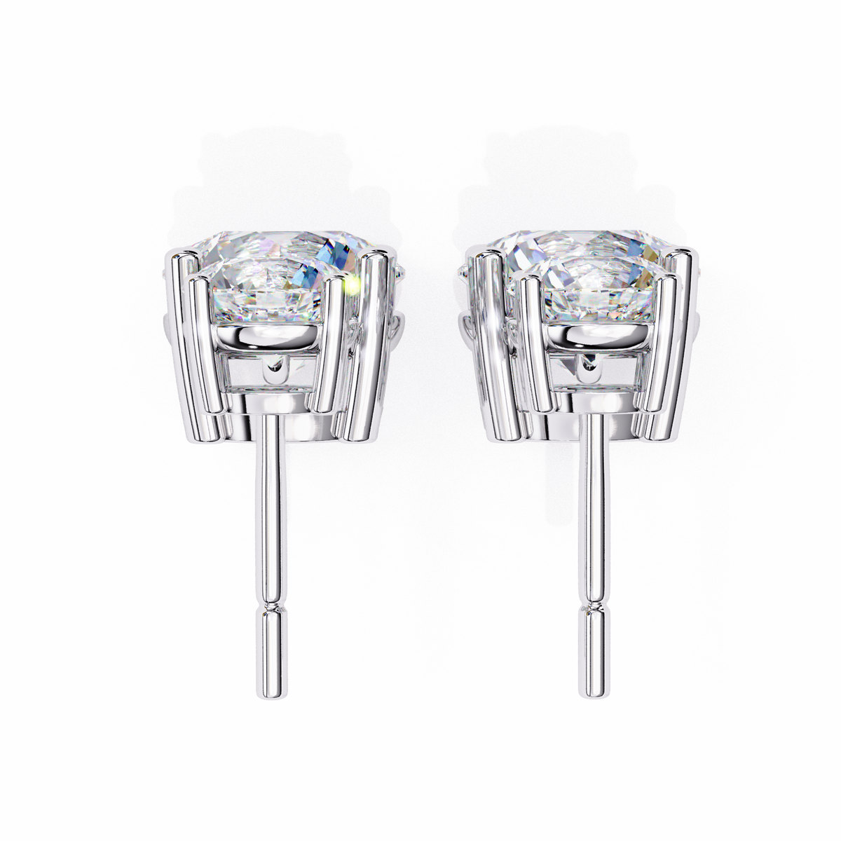 Pair of silver stud earrings with clear gemstones on a white background