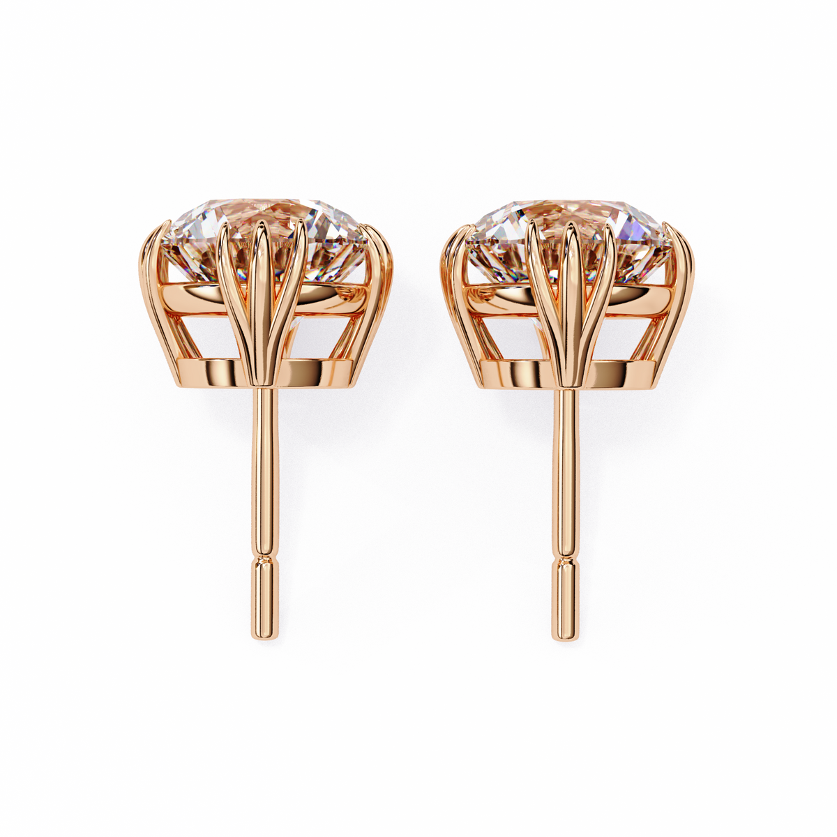 Rose gold earrings with clear gemstones on a white background