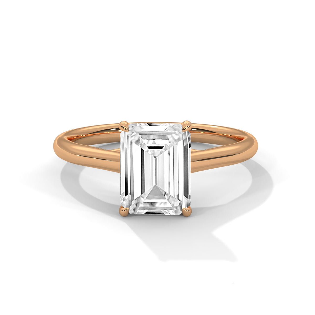 Gold ring with a rectangular diamond on a white background