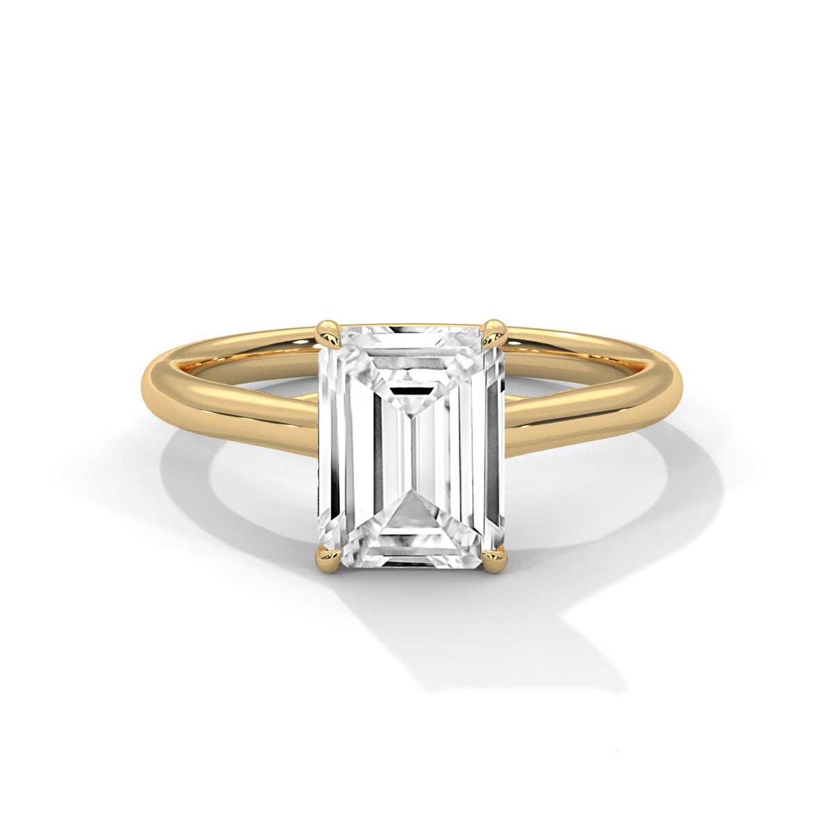 Gold ring with a rectangular diamond on a white background