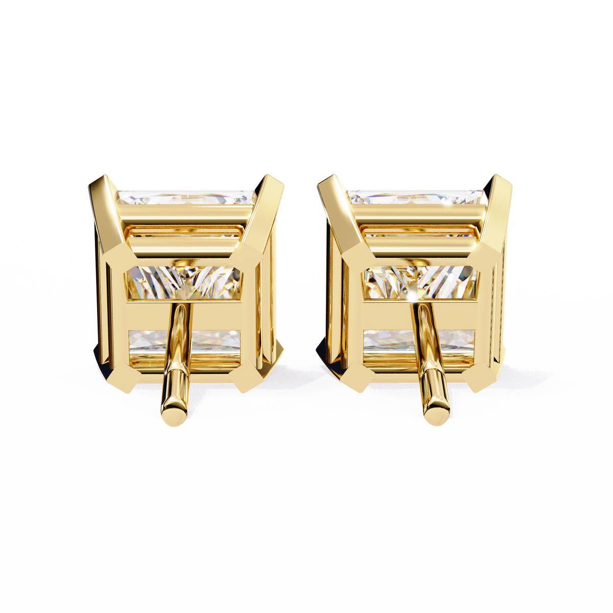 Gold earrings with clear gemstones on a white background