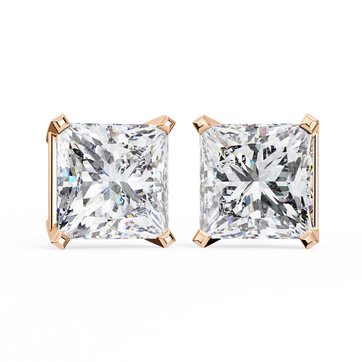 Pair of diamond stud earrings with rose gold prongs on a white background