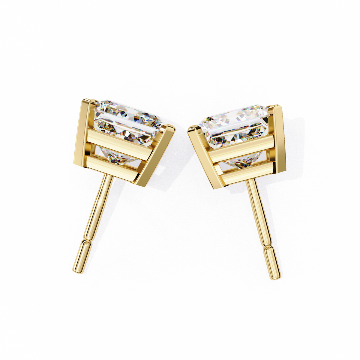 Gold earrings with clear gemstones on a white background