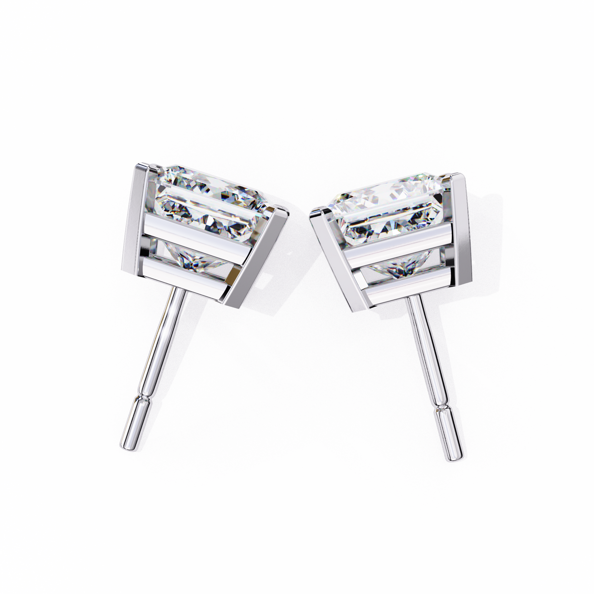 Pair of silver stud earrings with clear gemstones on a white background