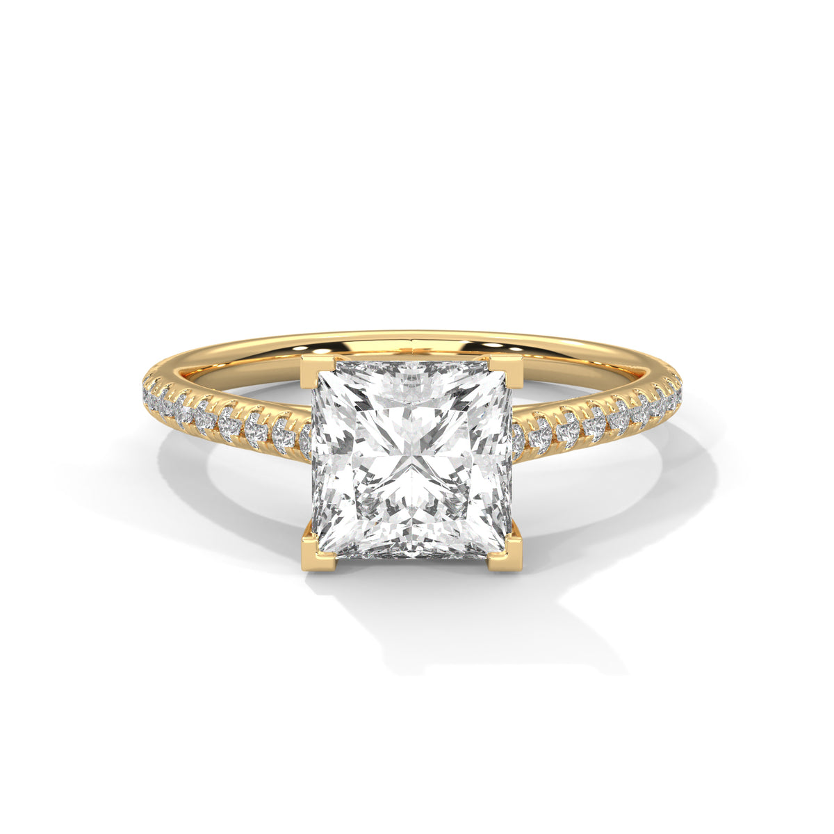 Gold ring with a large diamond and smaller diamonds on the band against a white background