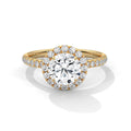 Rose gold diamond ring with a clear gemstone on a white background