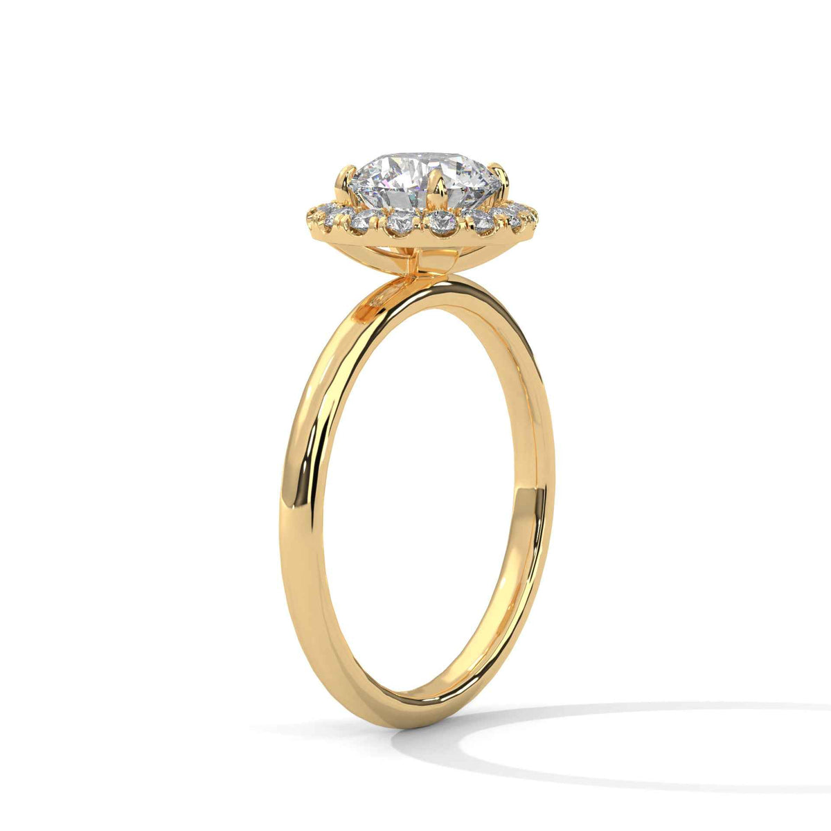 Gold ring with a diamond on a white background