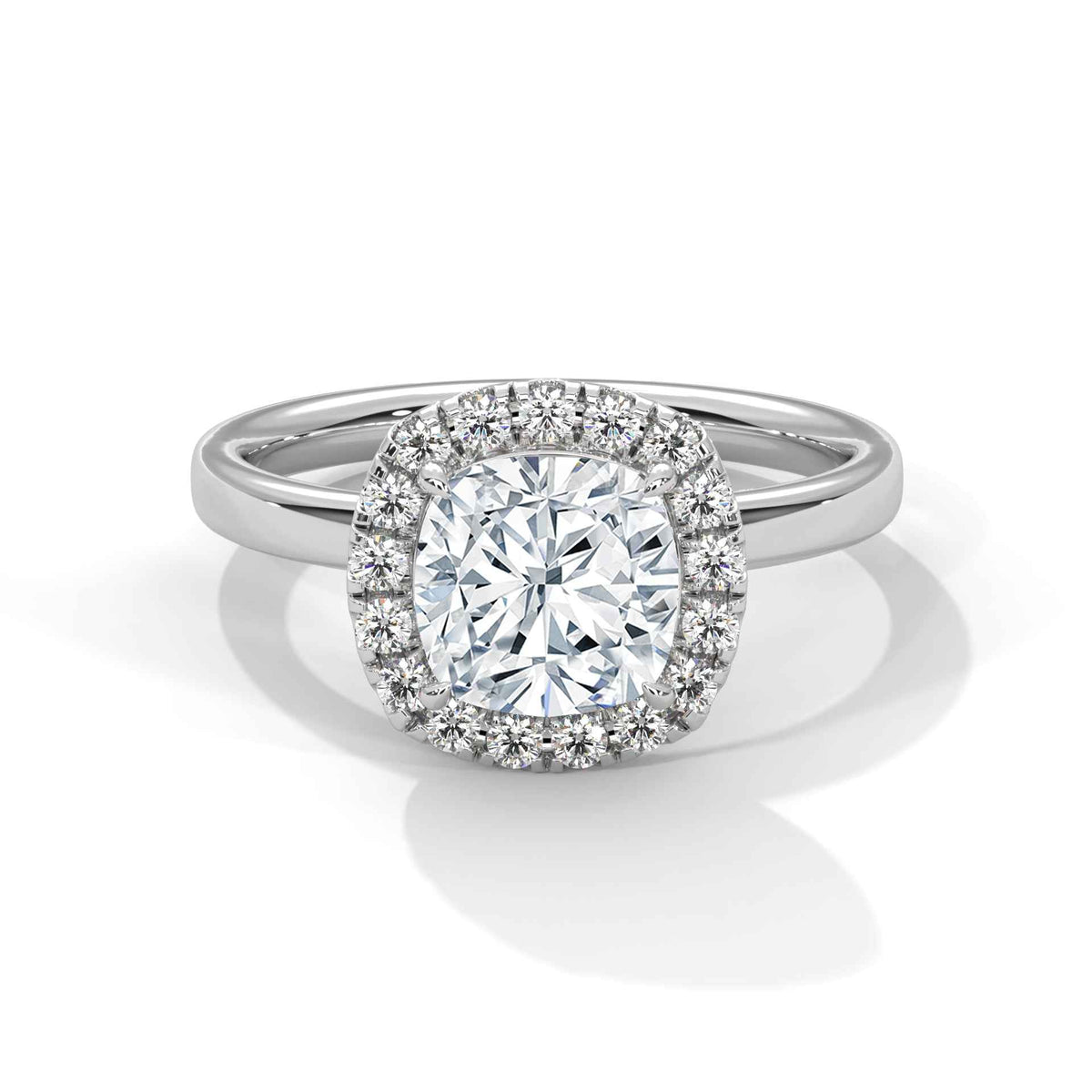 Diamond ring with a halo on a white background