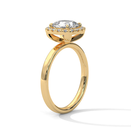 Gold ring with a diamond on a white background