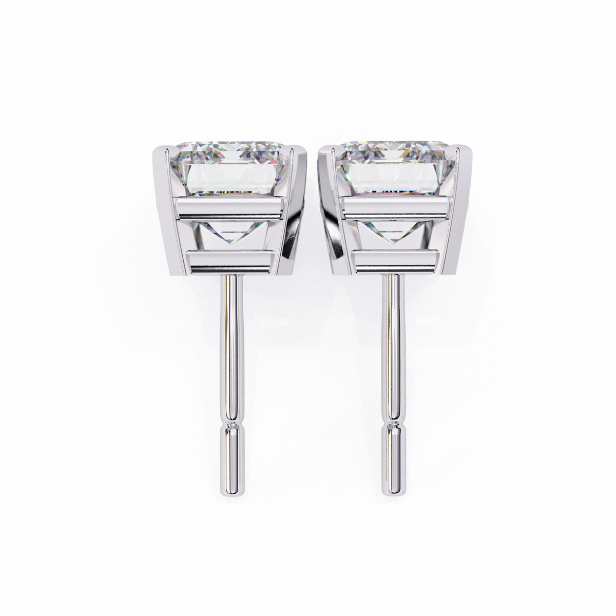 Pair of silver earrings with clear gemstones on a white background