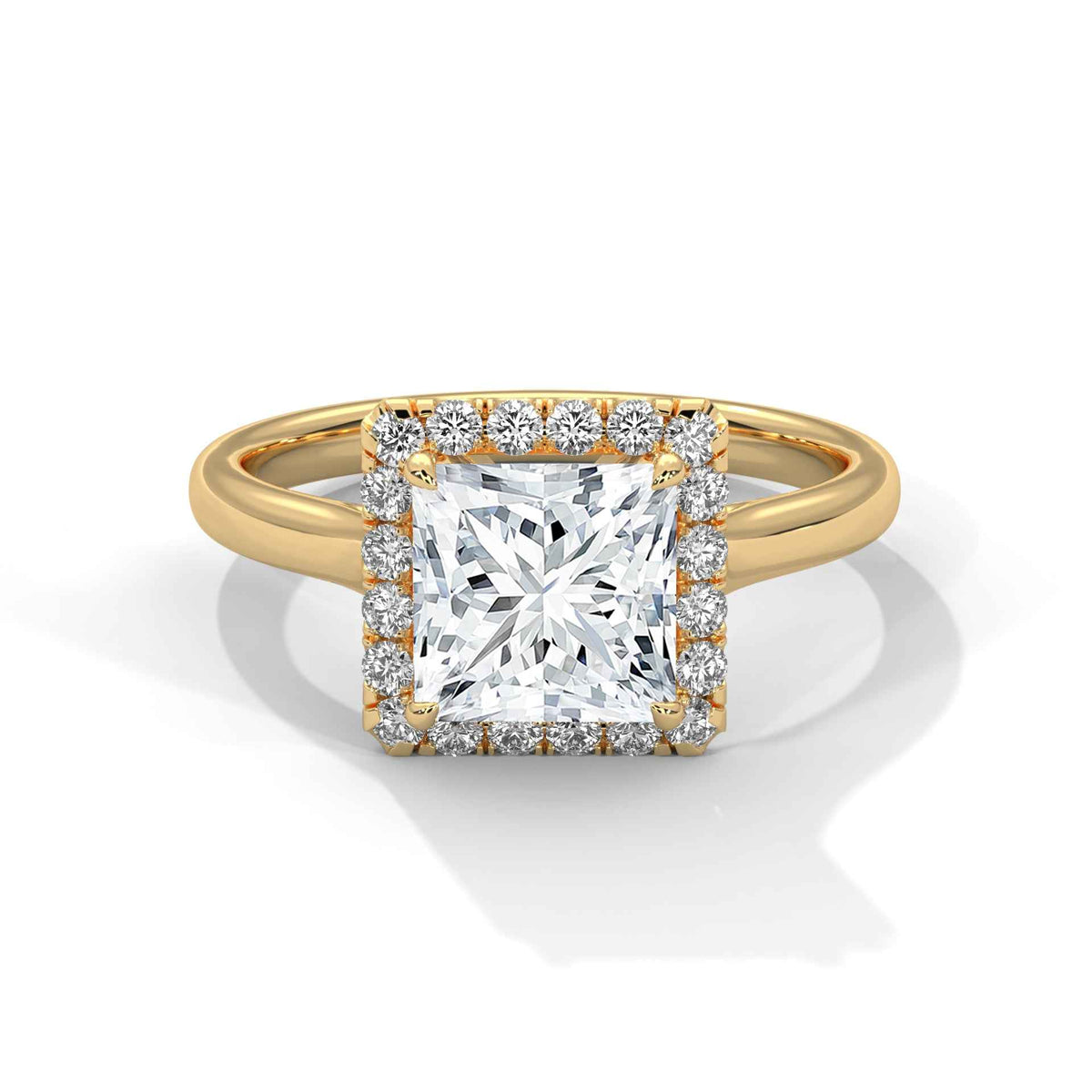 Gold ring with a large diamond and smaller diamonds on the band against a white background